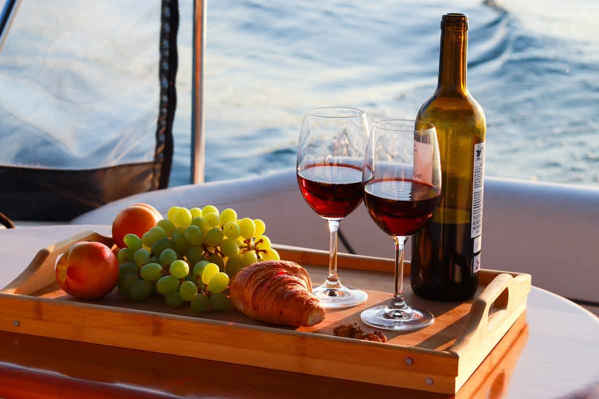 A couple celebrating an easy summer day aboard the Nalu